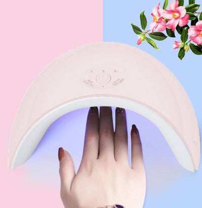 white LED phototherapy nail lamp curing polished nails under UV light