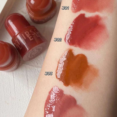 Girl Lip Balm swatches in shades J01, J02, and J03 on skin showing glossy lip glaze colors