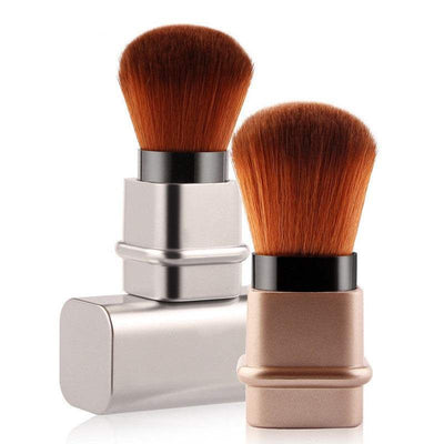 Portable single makeup brush with man-made fiber bristles and plastic handle in square silver and gold colors