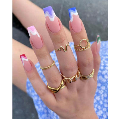 Extra long ballerina fake nails with colorful wave pattern and frosted finish on hand with gold rings