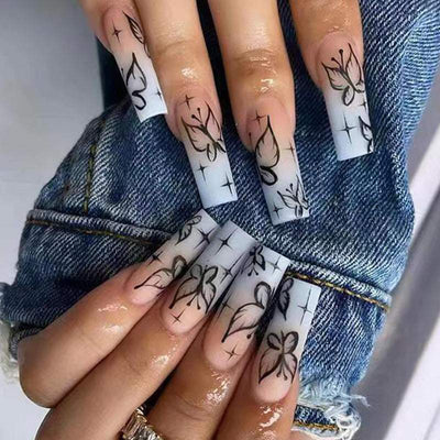 Smoke black gradient fake nails with butterfly and plaid designs on long square tips